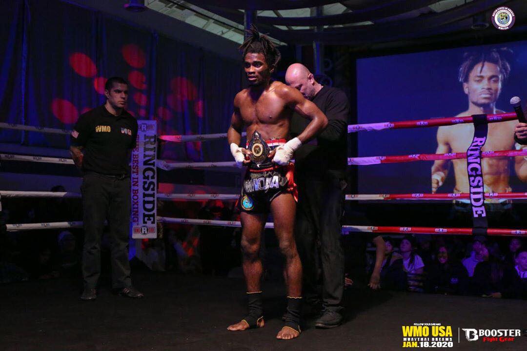 andre awarding a WMO belt